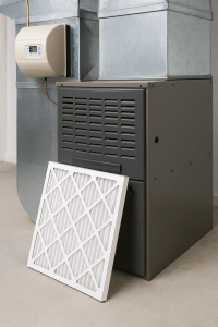 Indoor central air conditioning unit near a window, symbolizing allergy relief during spring with clean and efficient air filtration.